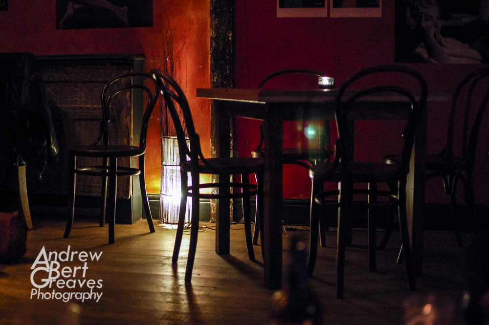 empty chairs and table in a bar