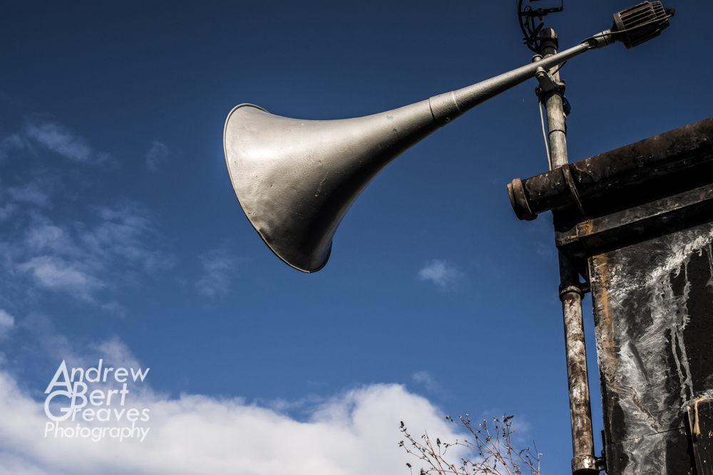 an old horn shaped speaker for a public address system