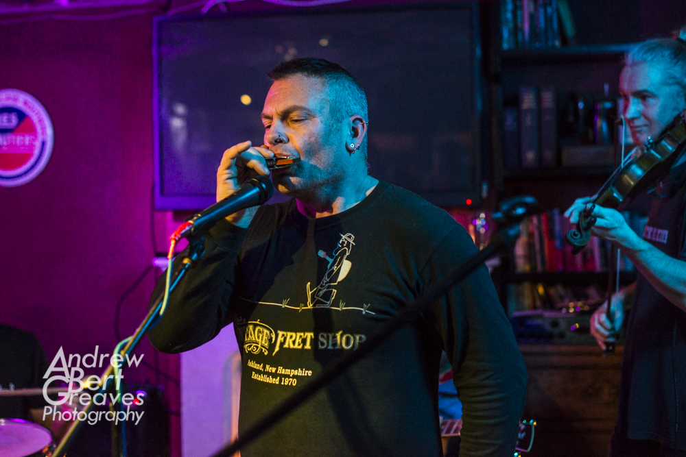 A harmonica player at a jam at the tree horseshoes in Bradford On Avon