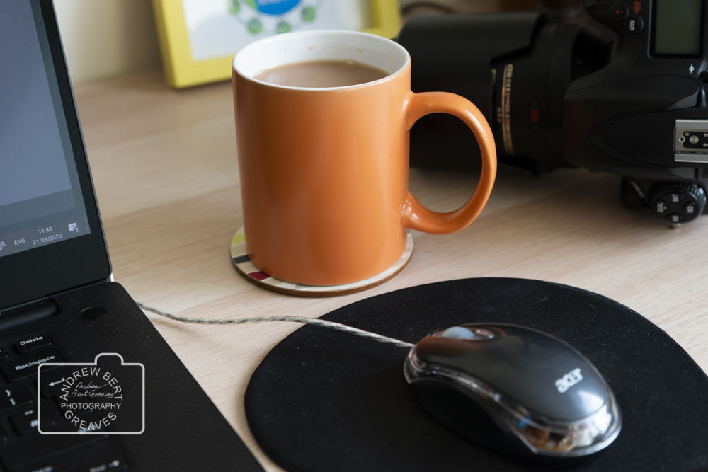 Contact A mug of tea, laptop and a DSLR camera