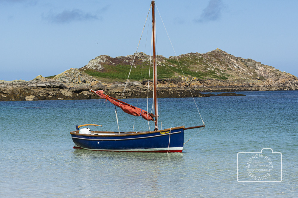 Sail boat at anchor off St Martin's, Isles of Scilly Sail boat at anchor off St Martin's, Isles of Scilly